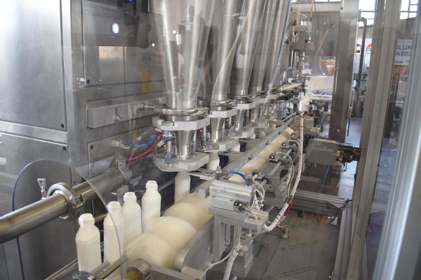 Mixing, filling and capping line for powders