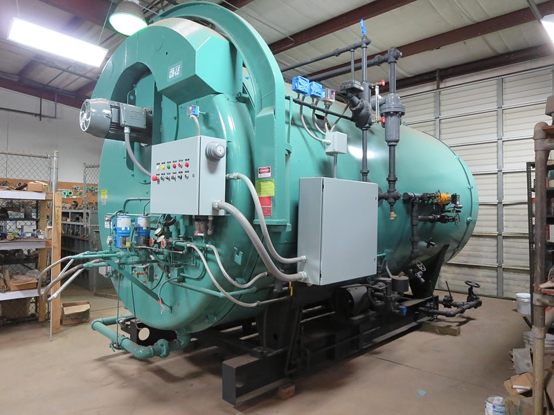 Large grey packaged boiler supplied by Energy Equipment Co