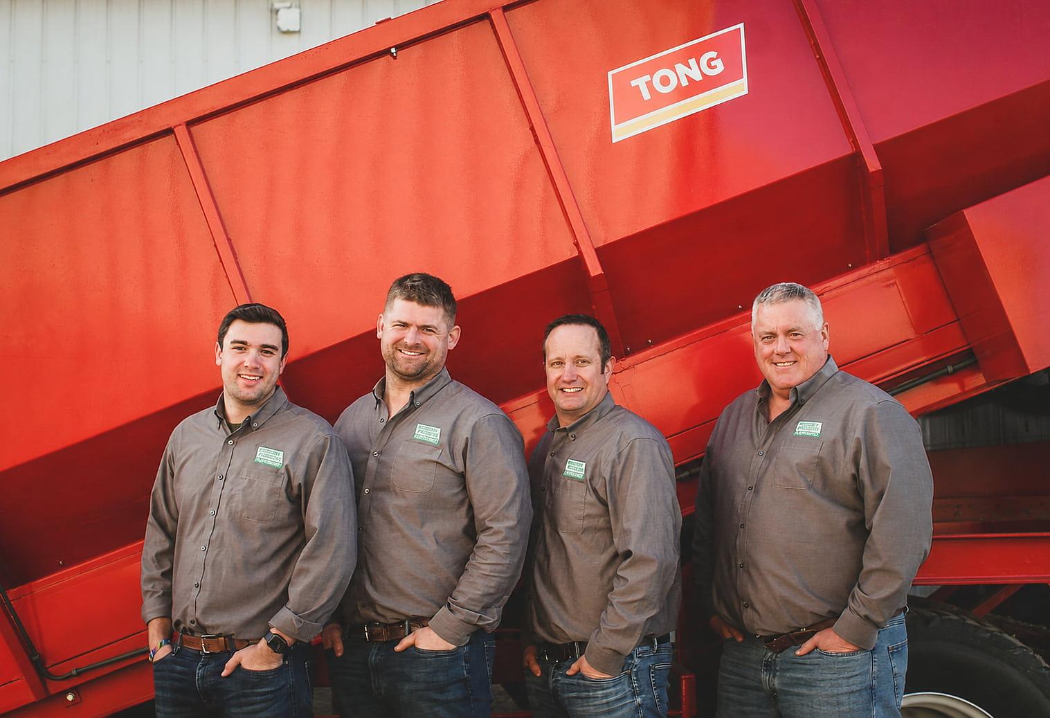 The Modern Produce Equipment team in front of Tong Engineering equipment
