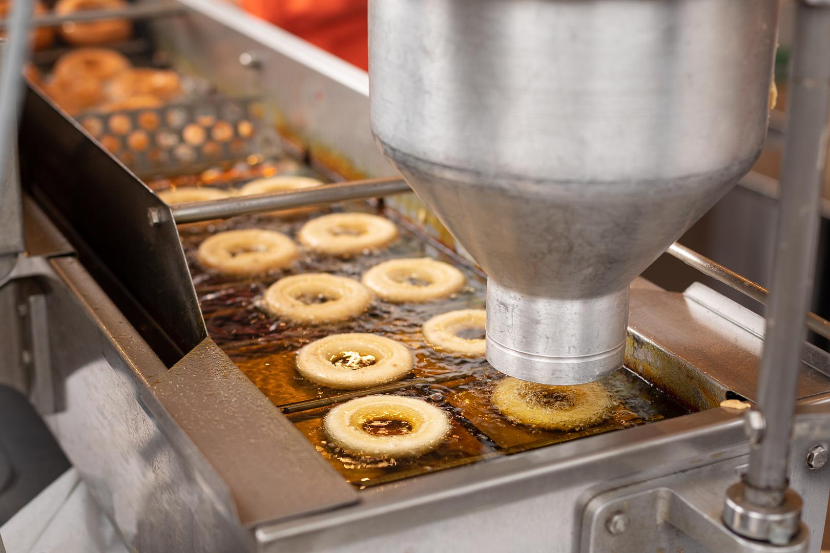 Bakery professional reviewing depositor equipment
