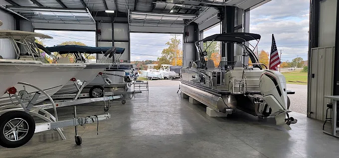 Boats on trailers inside the Coast to Coast Marine service bay