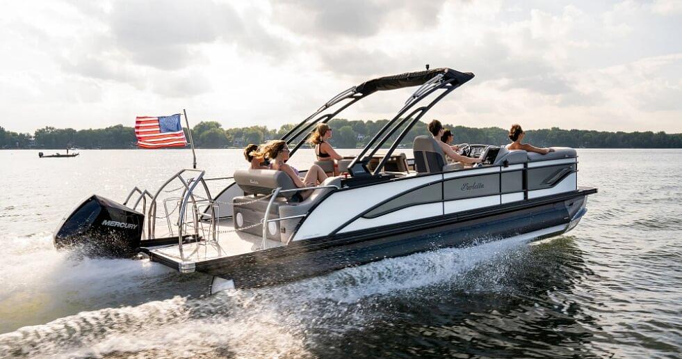 Barletta pontoon with a Vantage wrap and guard combo kit on the water