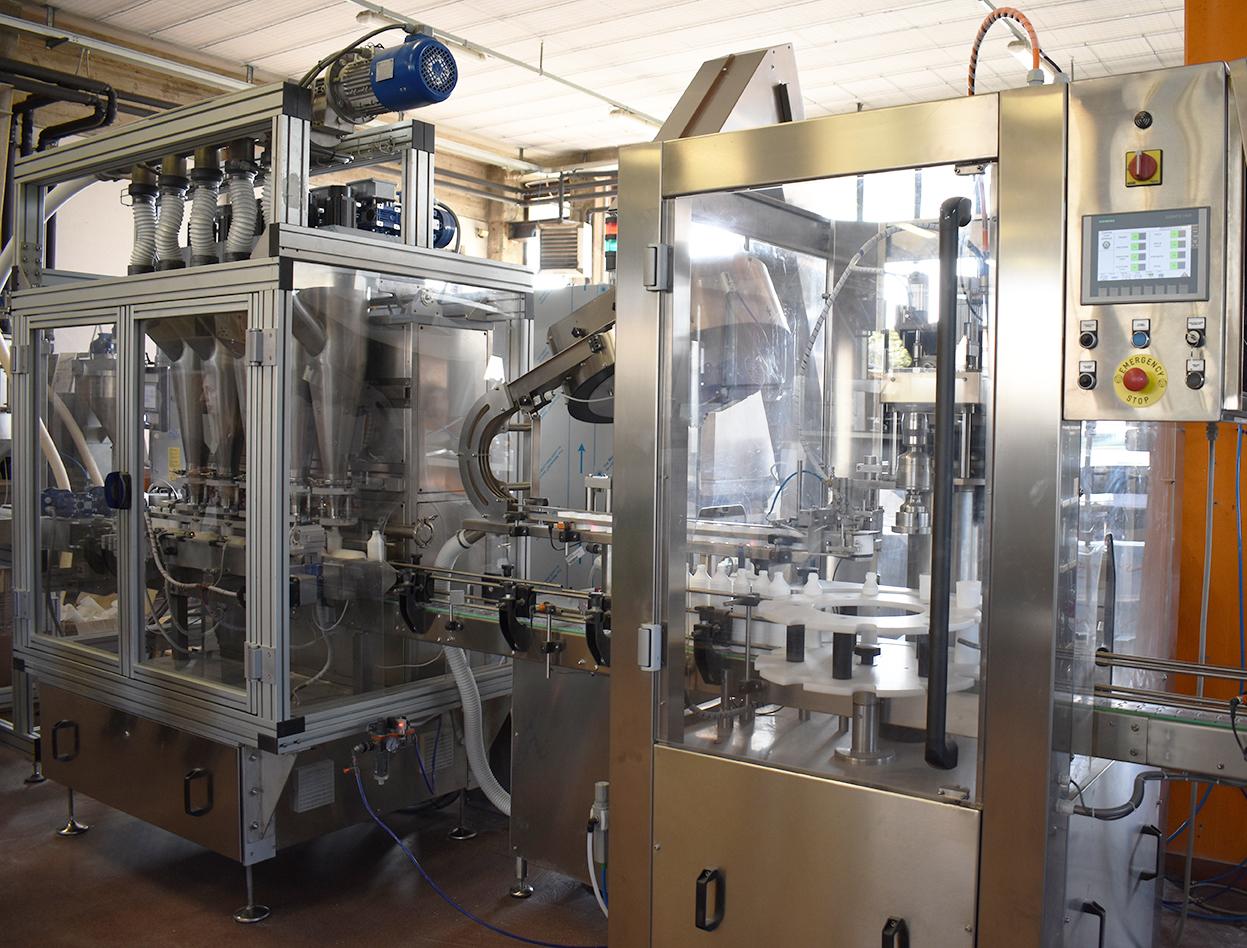 Mixing, filling and capping line for powders