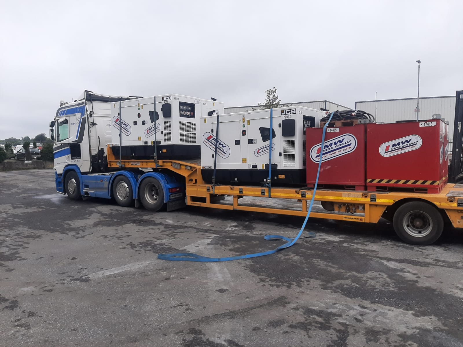 Load of Generators and Fuel Tanks heading on a rental project