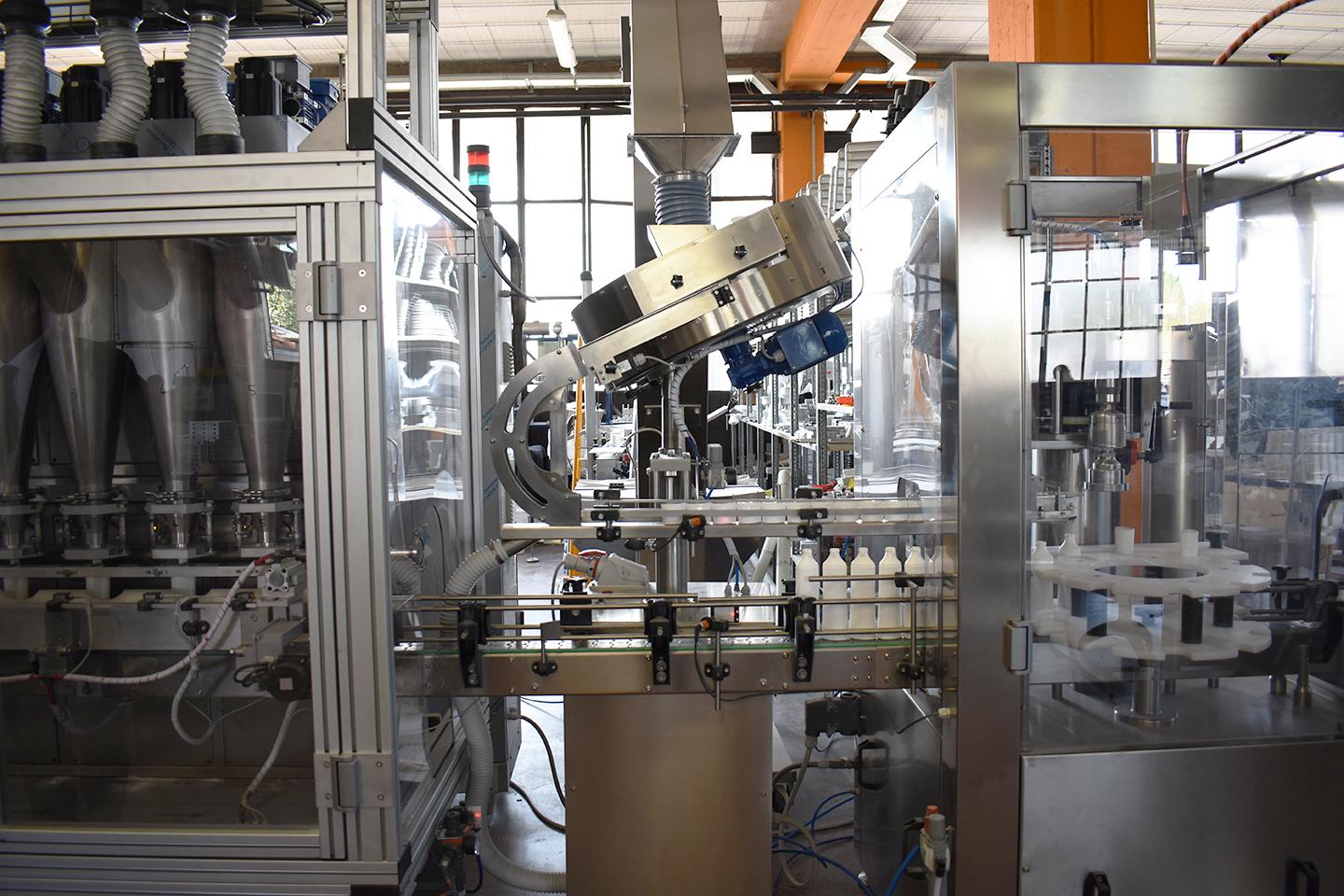 Mixing, filling and capping line for powders