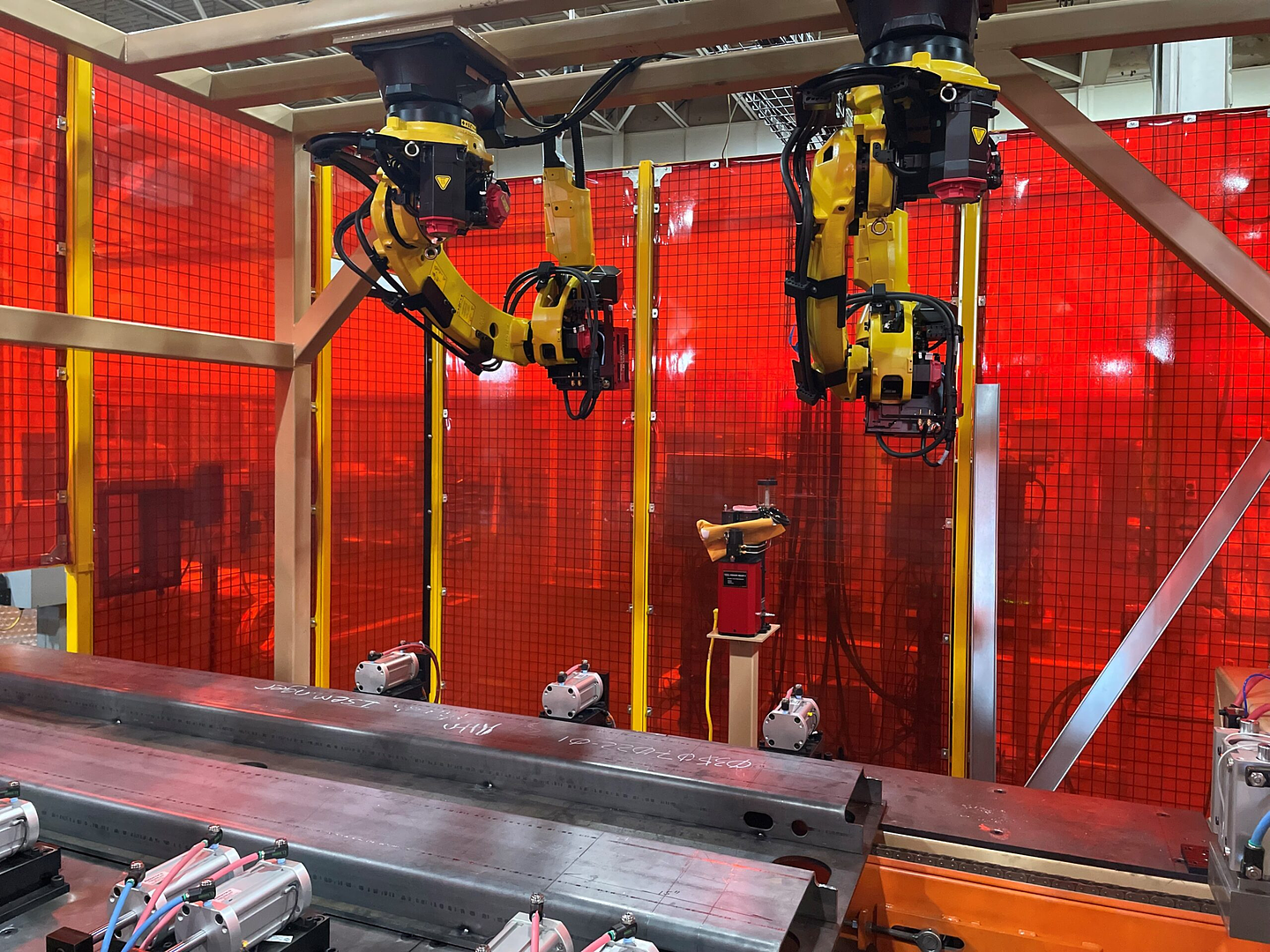 Overhead mounted Fanuc Arc Mate robots welding at Robot World Automation