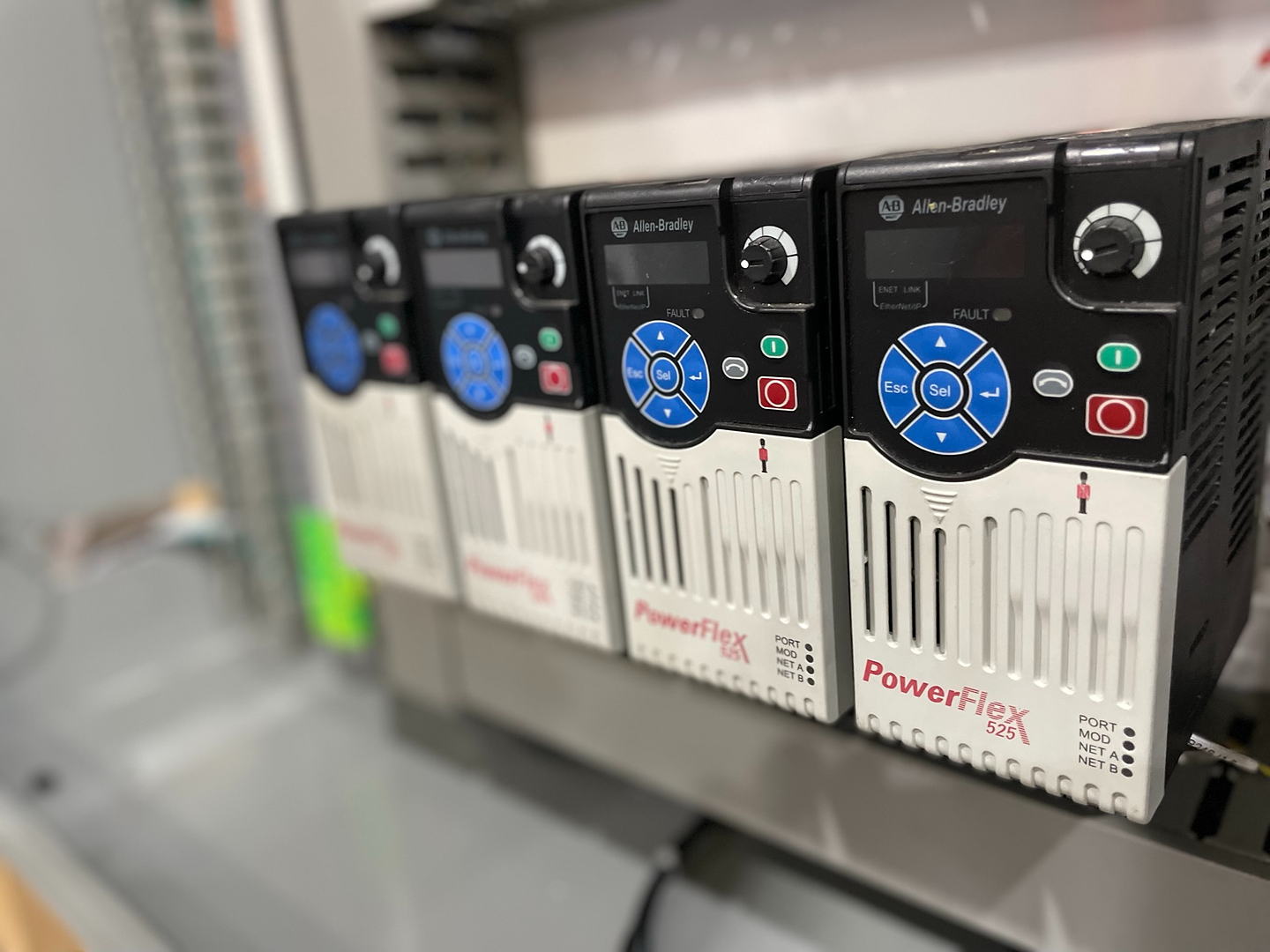 Allen-Bradley PowerFlex variable frequency drives in a control panel at Robot World Automation