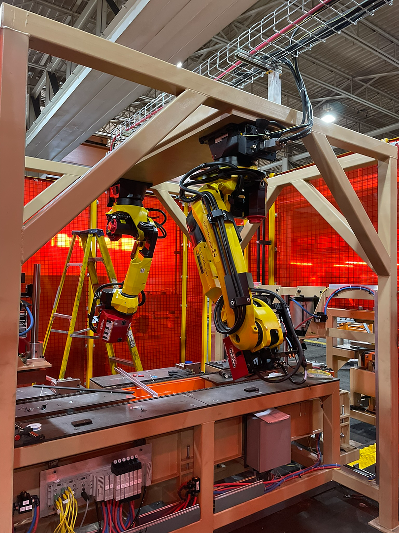 Overhead mounted dual robot welding cell at Robot World Automation