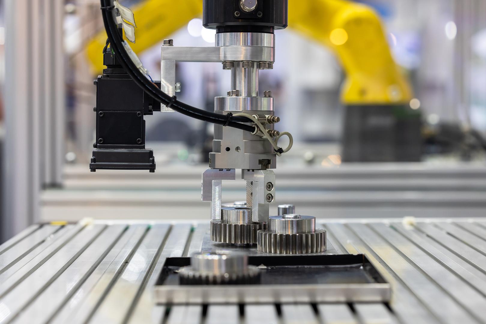 Close up of precision gears and mechanical components repaired by Robot World Automation
