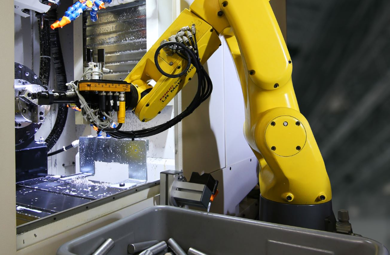 Fanuc robot tending a machining center during scheduled maintenance