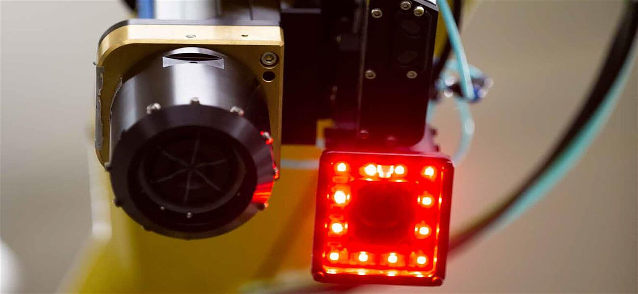 Close-up of a robot vision sensor during a maintenance inspection