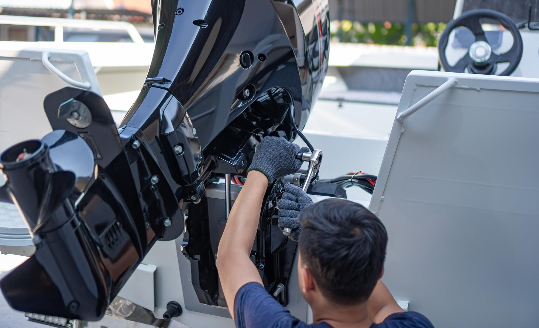 Old outboard engine removed from a boat before a repower