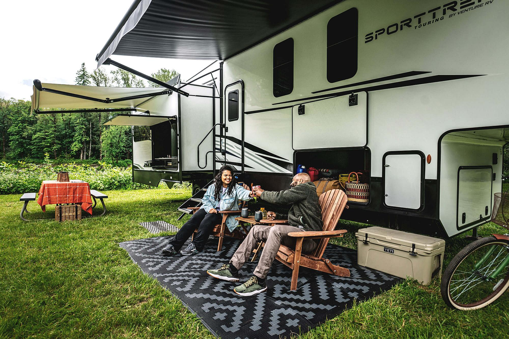 Venture RV Sport Trek Touring Edition fifth wheel at a campground