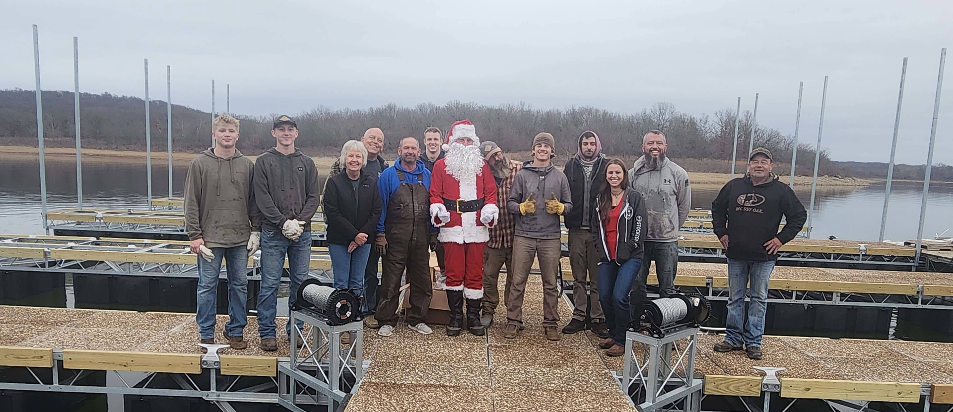 A group photo with Santa Claus at a marina holiday gathering