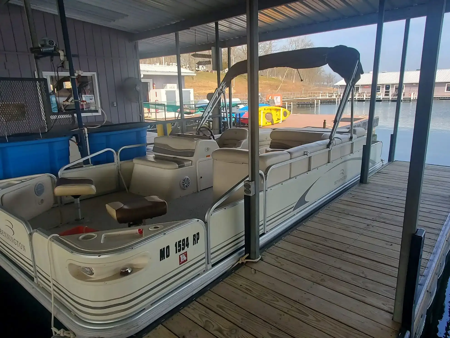 2005 Bennington pontoon rental on the boat lift at Mutton Creek Marina