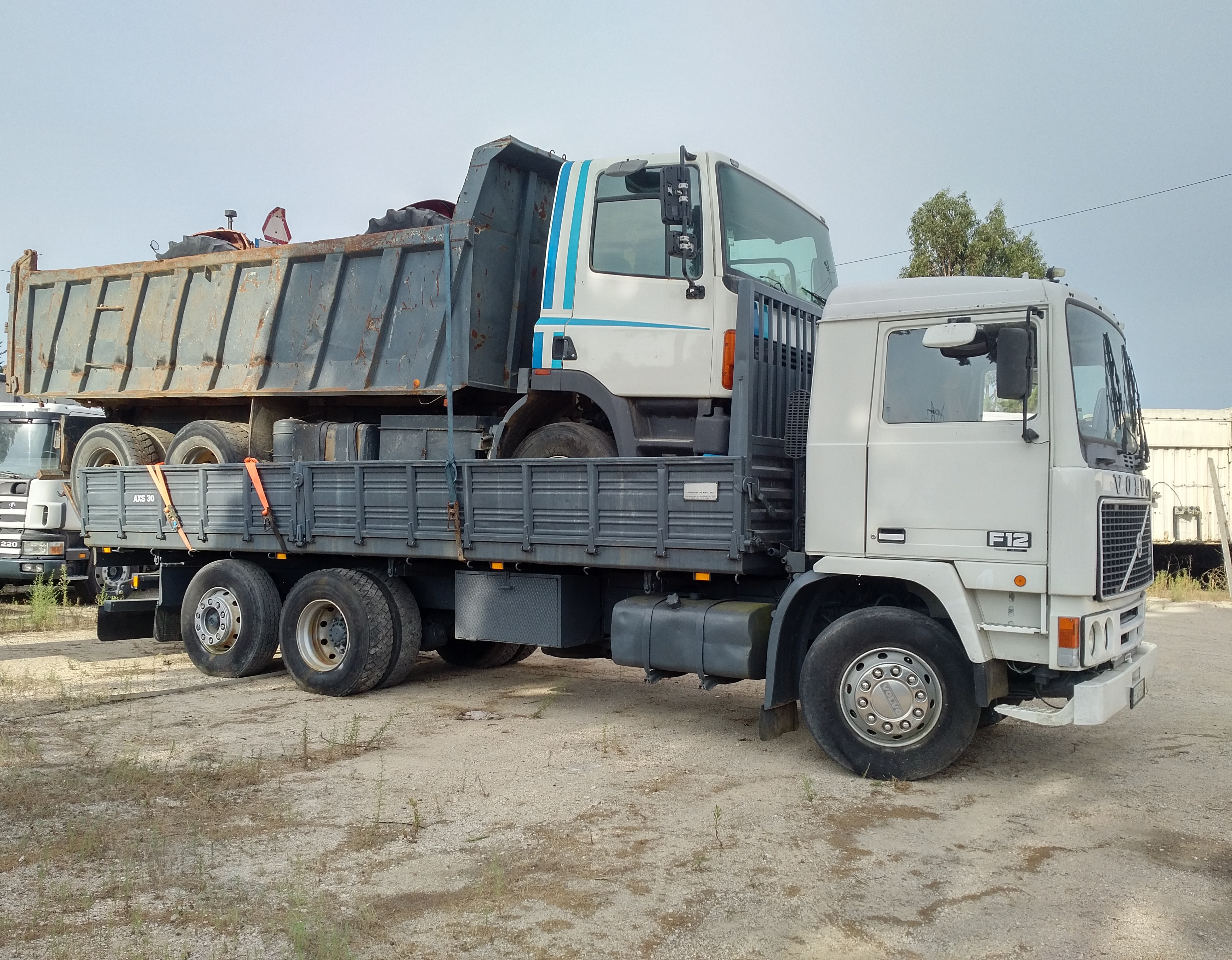 Volvo F12 360 6X2 tipper loaded with DAF 85 360 ATI 6X4 tipper & 2 x FIAT 640 farm tractors sold to Nigeria.