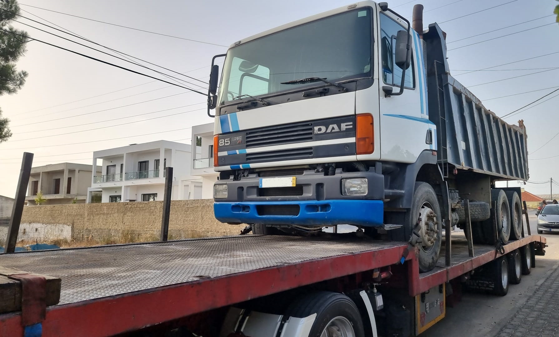 Transport of DAF 85 360 ATI 6X4 tipper loaded with 2 x FIAT 640 farm tractors.