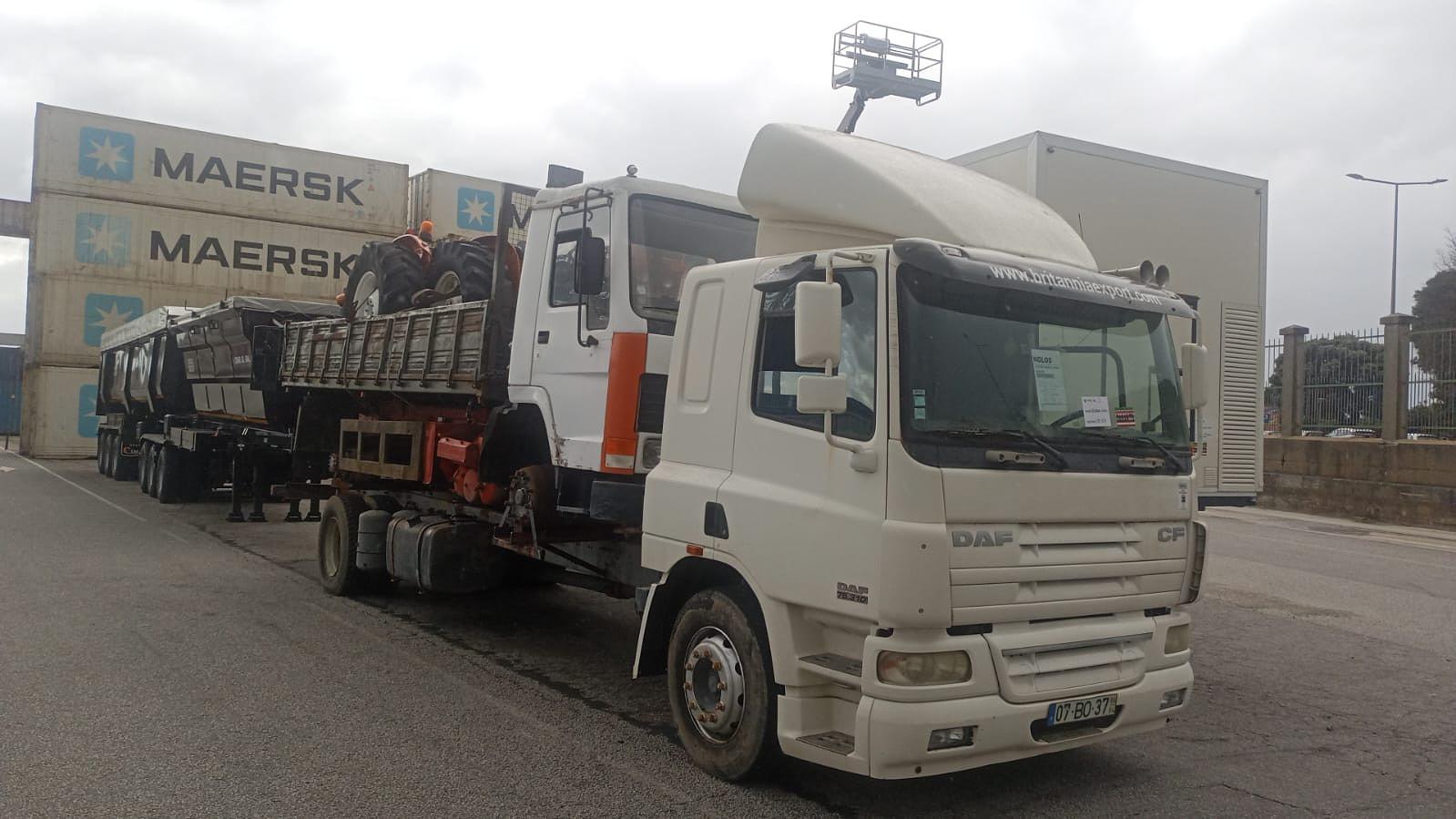Grimaldi RoRo shipping of DAF CF 75.310 chassis cab truck loaded with Volvo FL7 tipper and two FIAT 640 farm tractors.