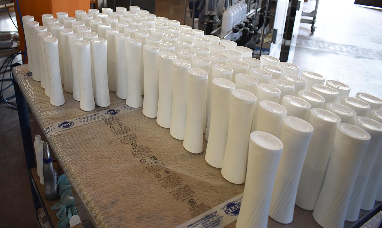 Mixing, filling and capping line for powders