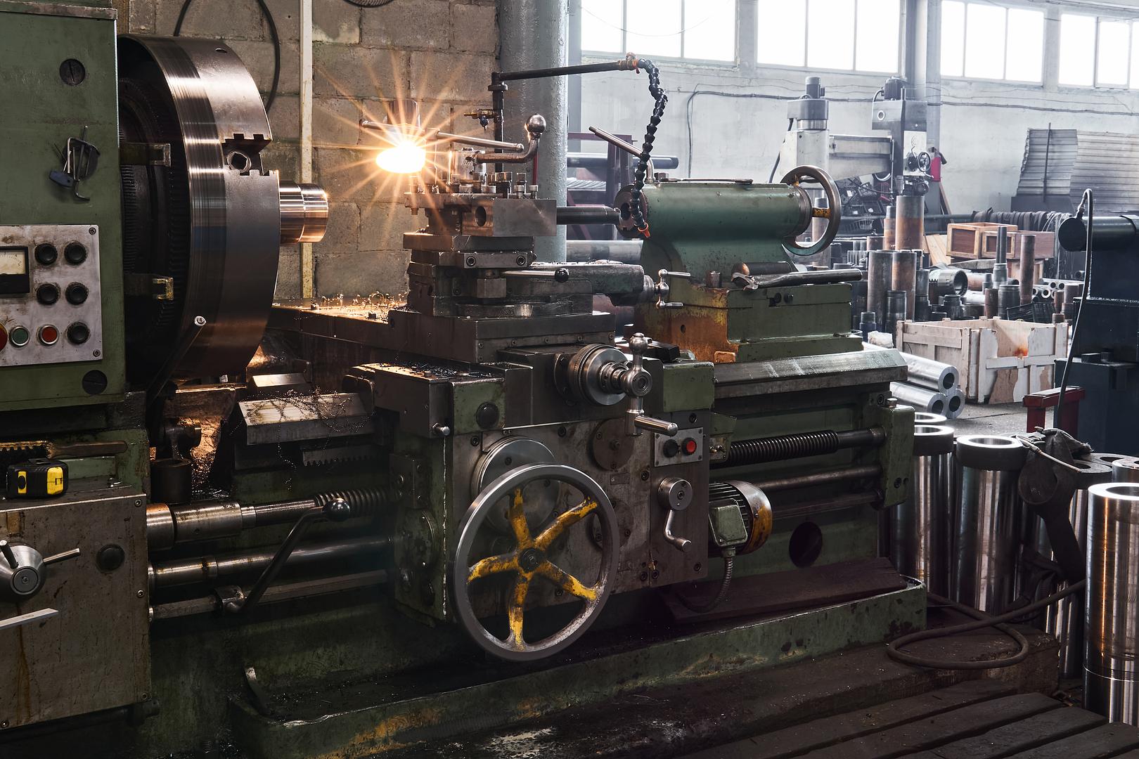 Machine shop floor with rows of lathes