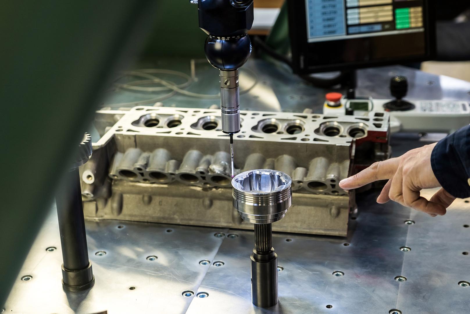 Dial indicator checking a machined surface