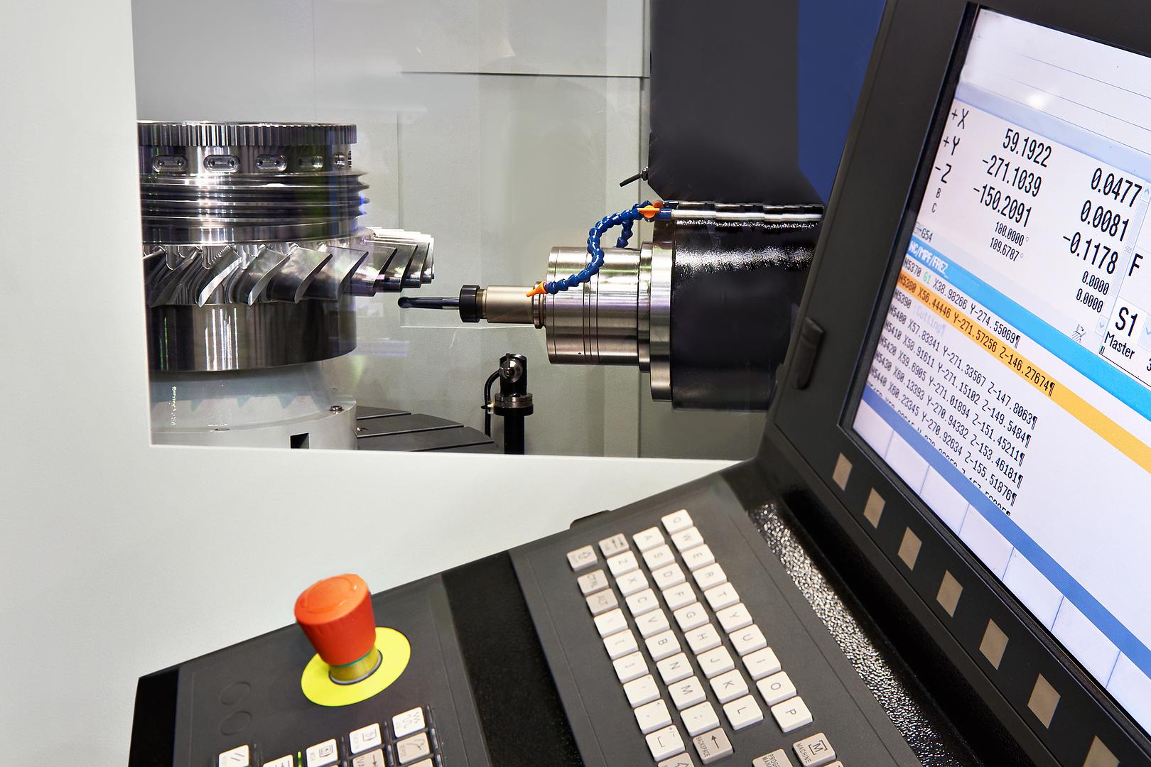 Machine control screen beside a cutting tool