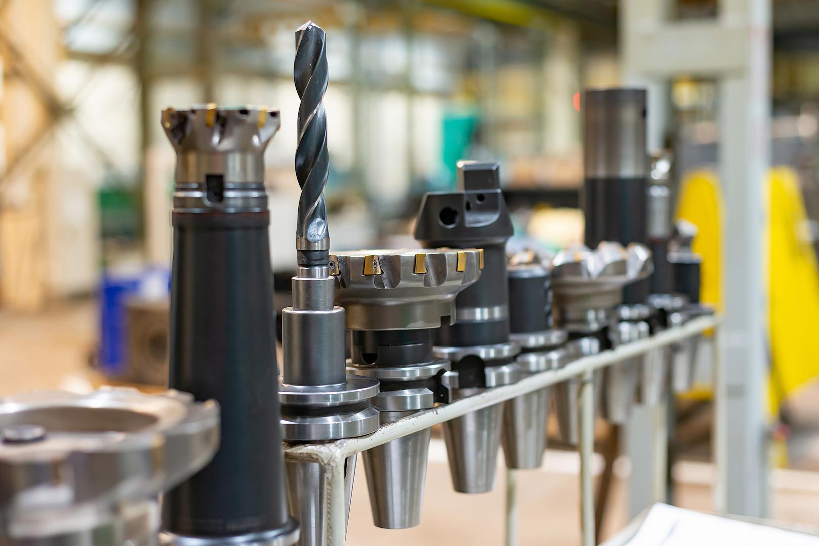 Tool holders and tooling lined up in a machine shop