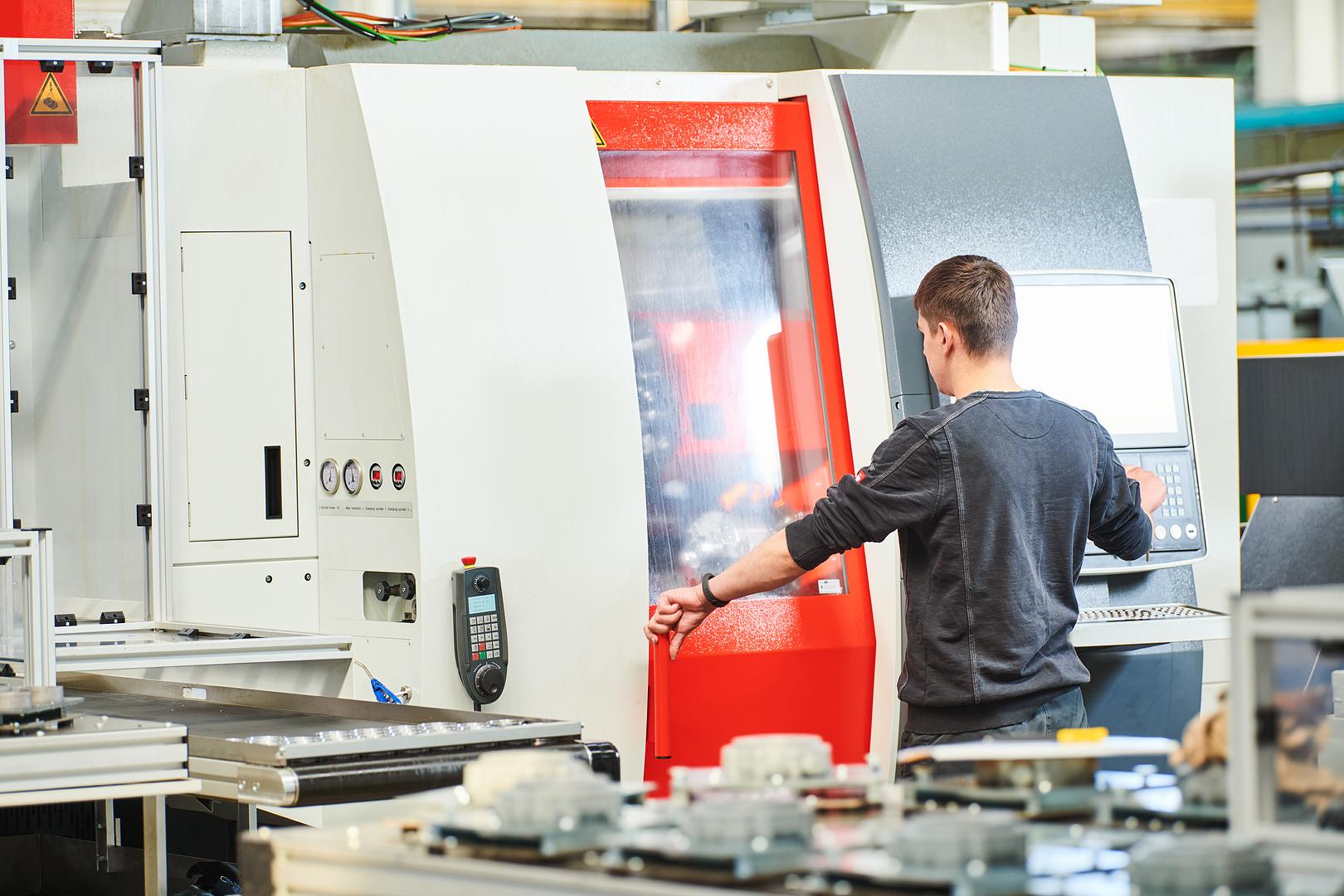 Technician working at a CNC machine