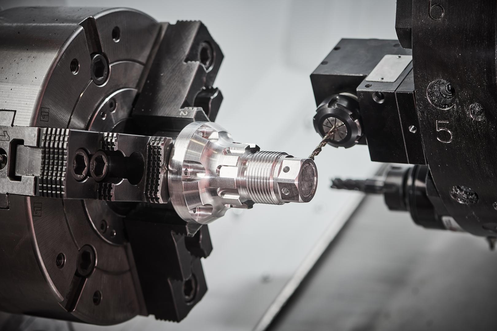 CNC lathe turret and spindle machining a part