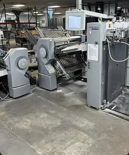 Brooks technicians working on printing equipment