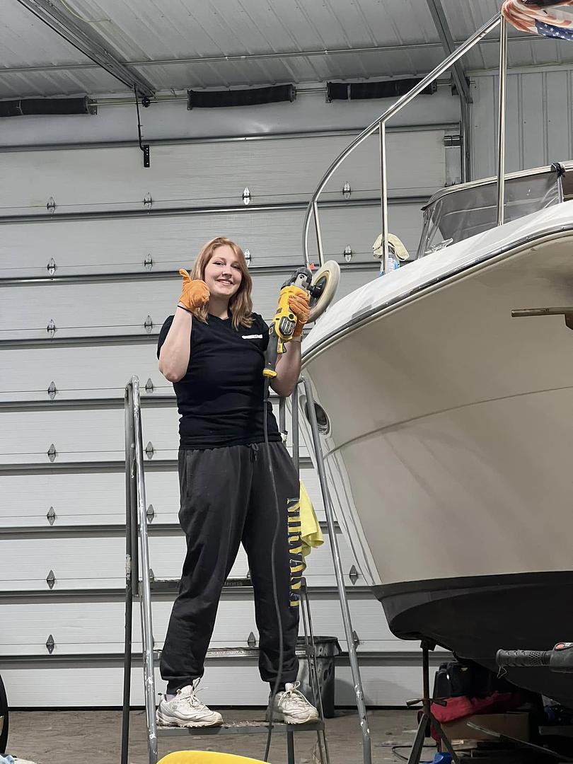 Service 1 Marine team member polishing a boat hull