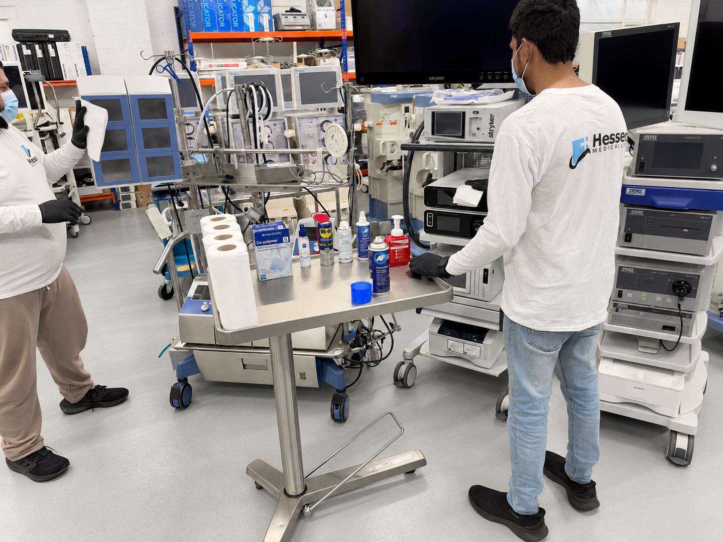 A member of the Hessen Medical team cleaning and preparing equipment.