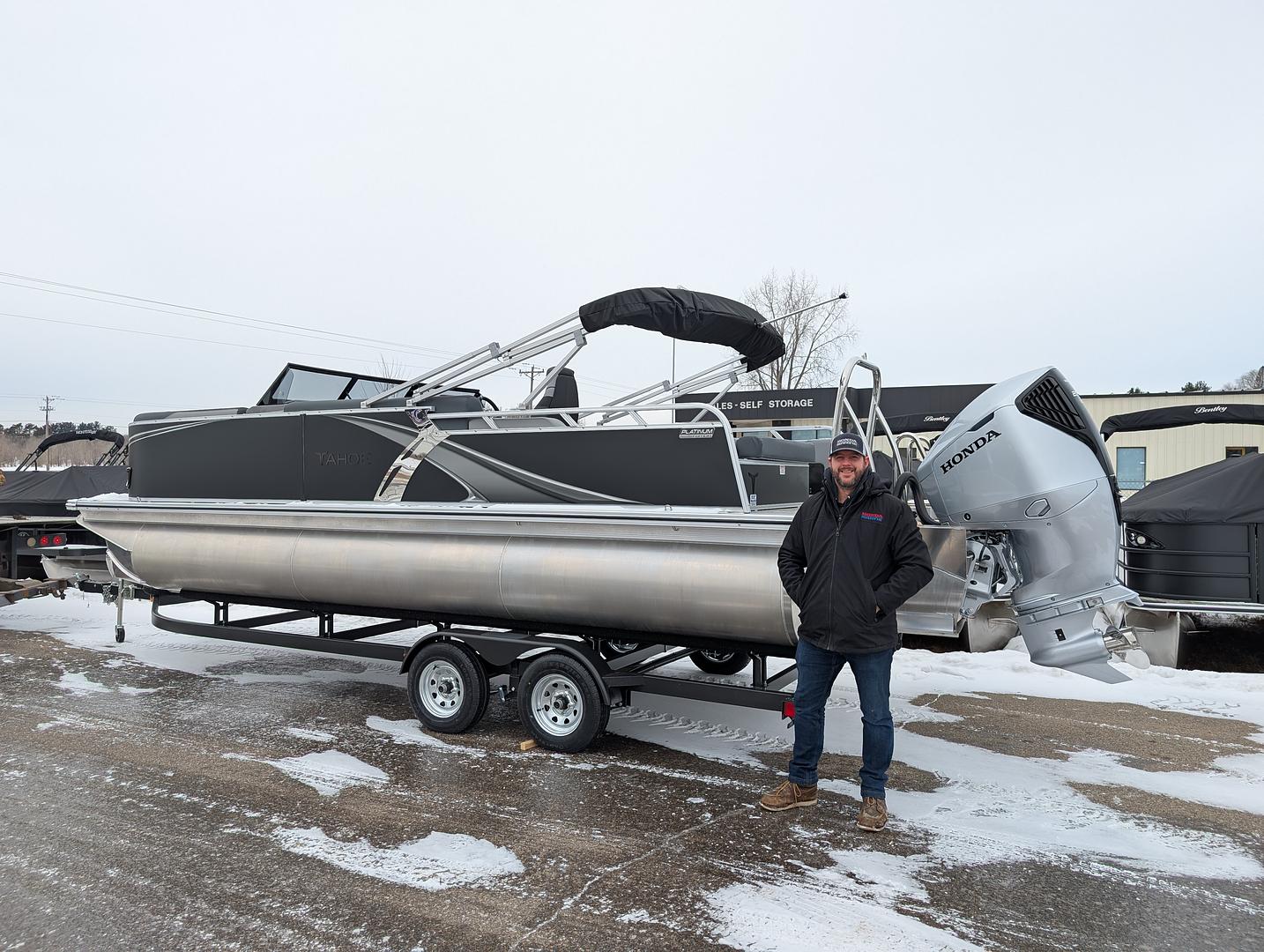 Robert from Lake Havasu City, Arizona with his new Tahoe LTZ 2385 VRB windshield tritoon powered by a 200 HP Honda outboard in black and gray