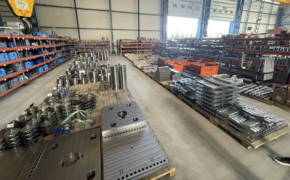 CoilTech North America warehouse floor with tooling, dies, and press feed components staged for shipment