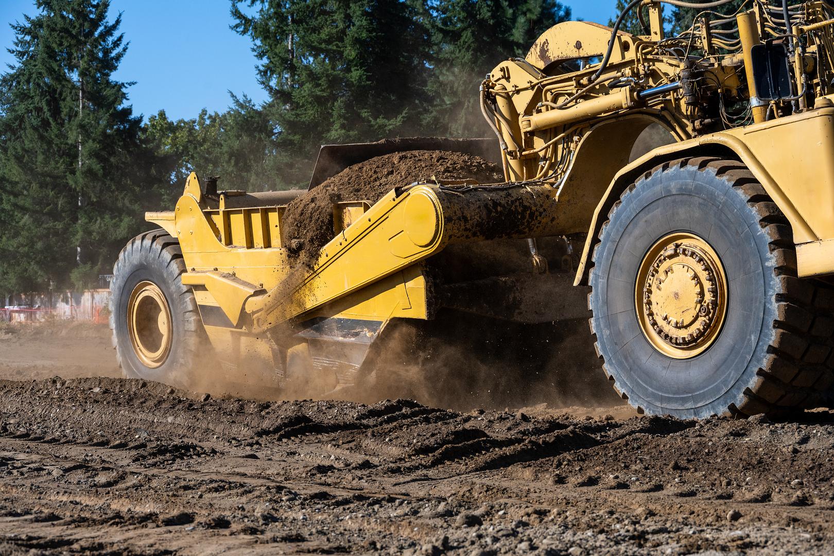 Ceasars screener processing excavated material on a grading job site