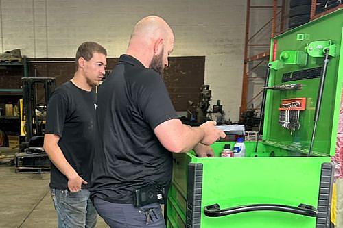 Technicians working at the service bench
