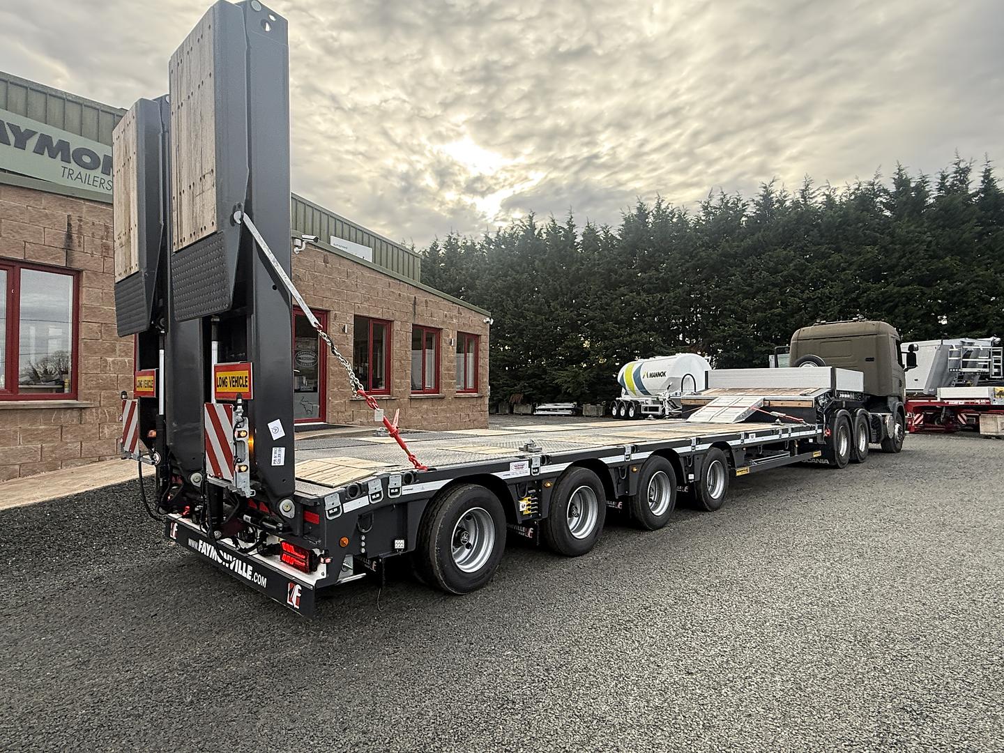 Department of Defence, on collection of new Faymonville 4 axle step frame low loader. 