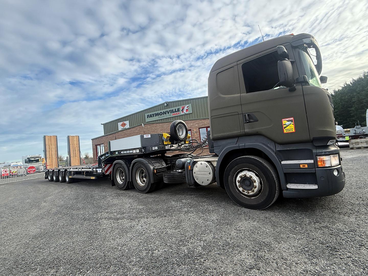 Department of Defence, on collection of new Faymonville 4 axle step frame low loader. 