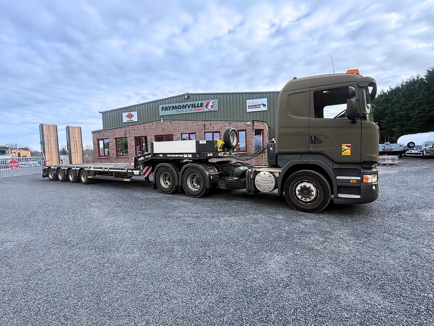 Department of Defence, on collection of new Faymonville 4 axle step frame low loader. 