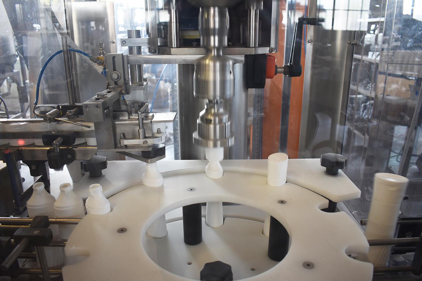 Mixing, filling and capping line for powders