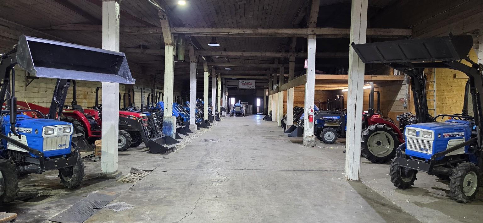 TractorCo warehouse aisle with TYM tractors
