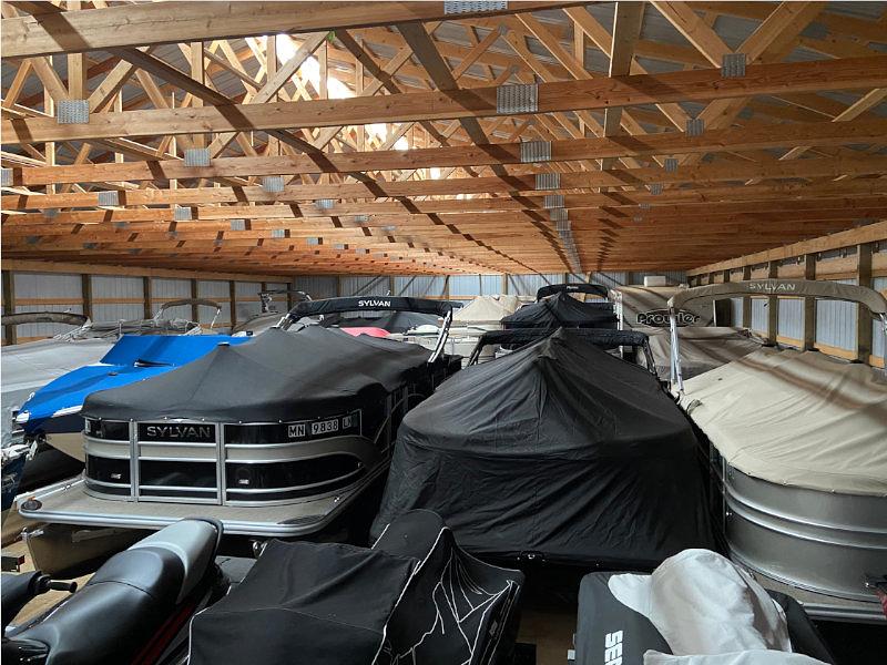 Boats parked inside storage facility