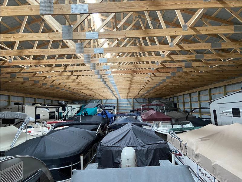 Interior view of storage building with covered boats