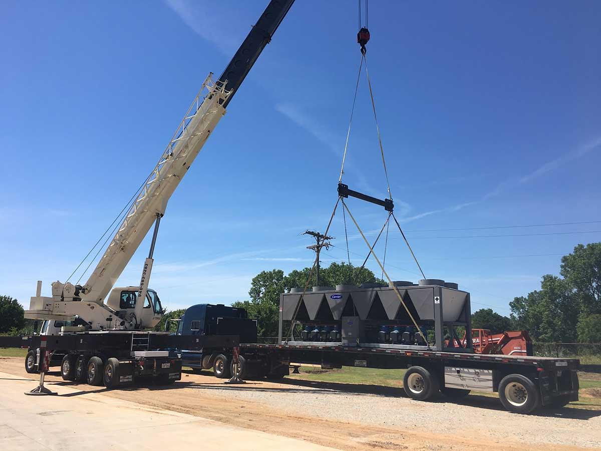 Chiller and cooling tower loaded on a flatbed trailer