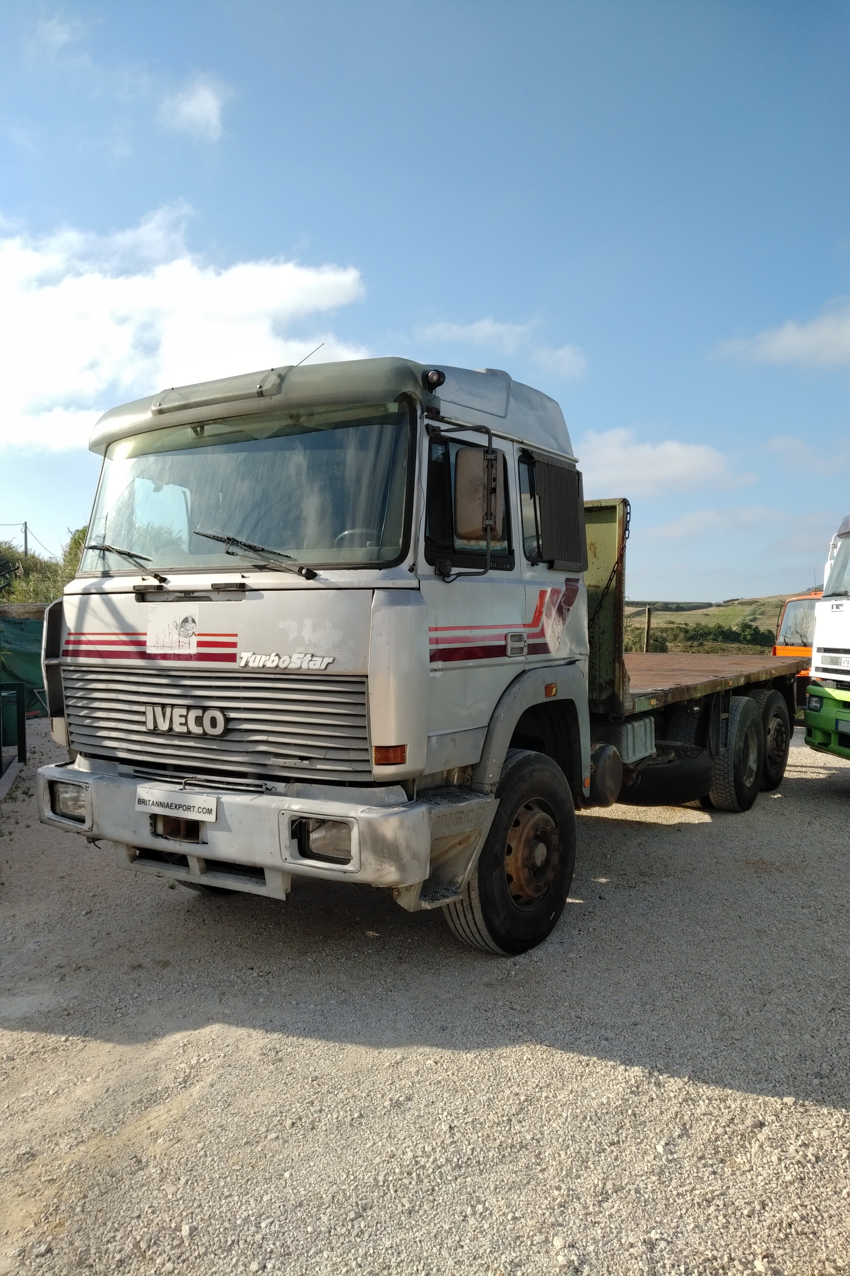 Left hand drive Iveco Turbostar 190-36 6X2 flatbed truck sold to Lagos - Nigeria.