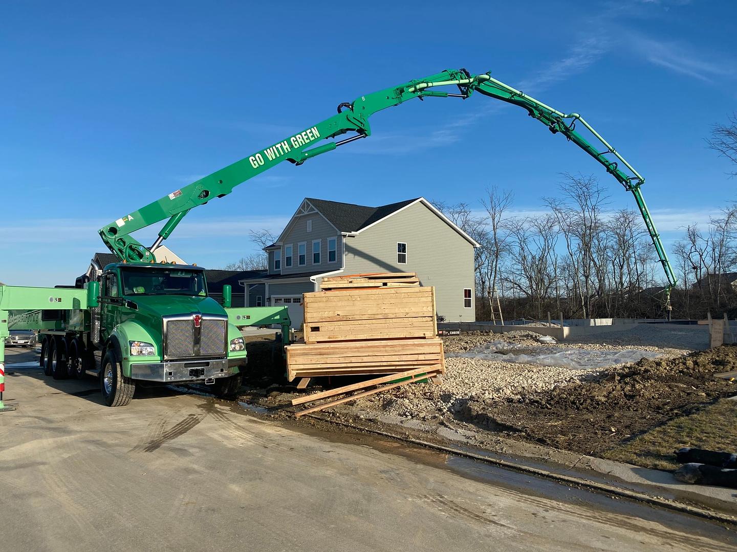 Ernst Concrete boom pump on job site