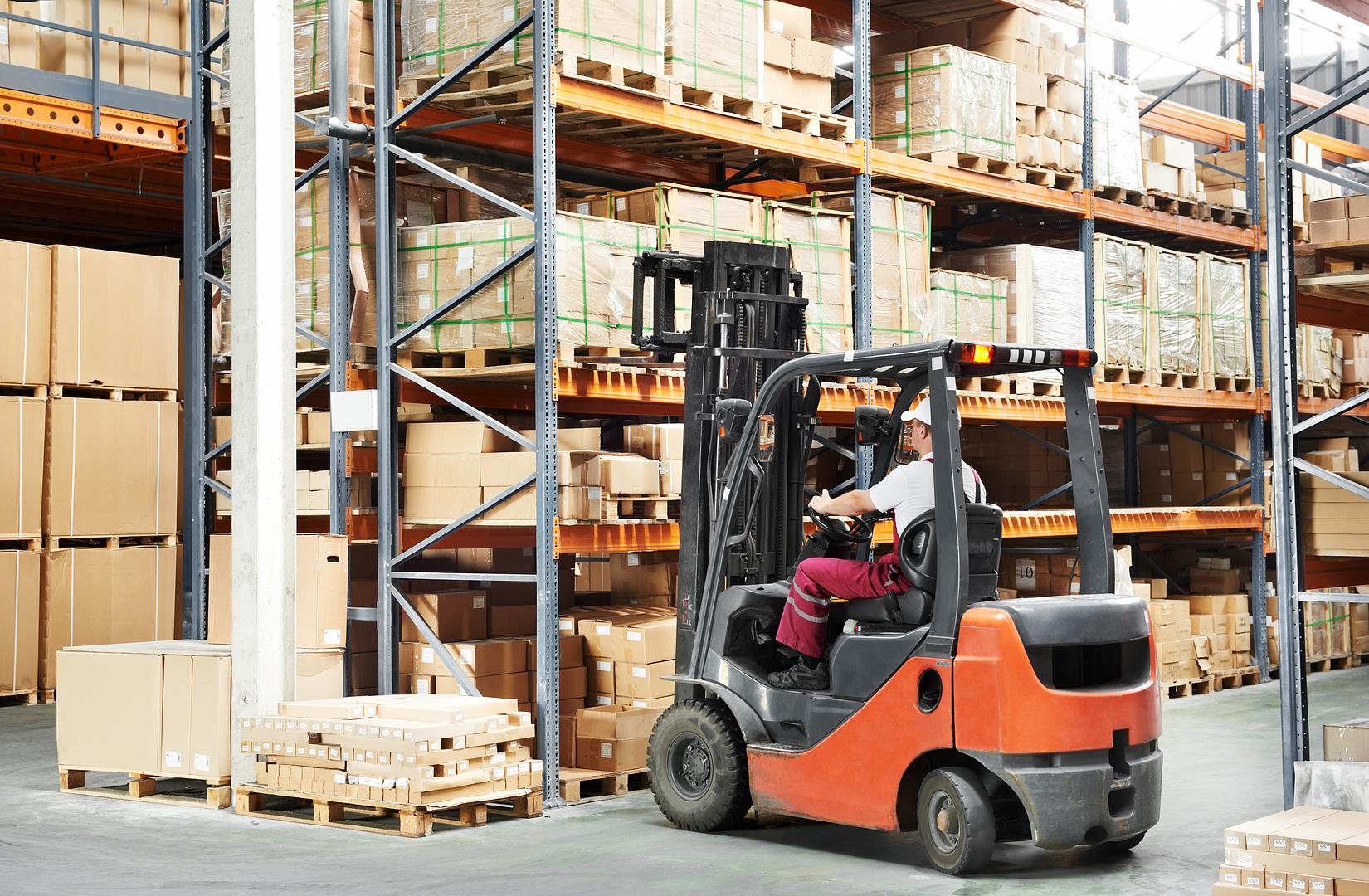 Technicians performing routine forklift maintenance