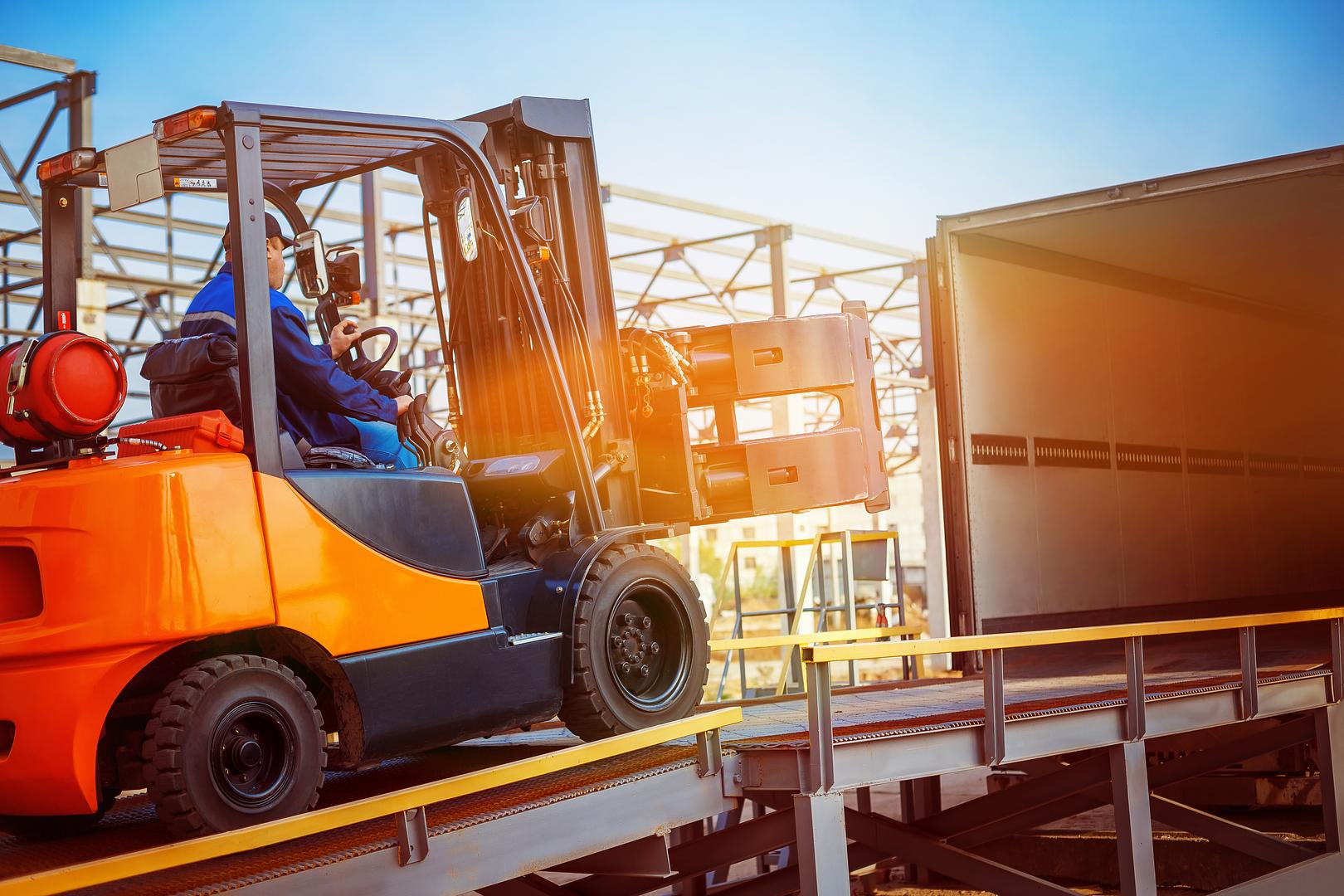 Inspecting a used forklift part for quality