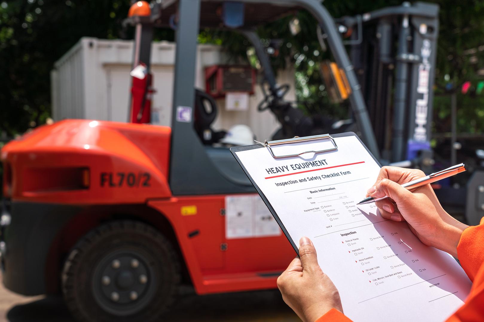 Mechanics servicing a forklift engine