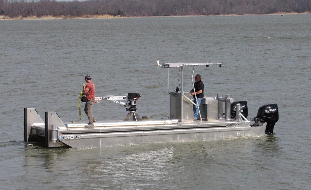SolidCraft commercial work boat underway